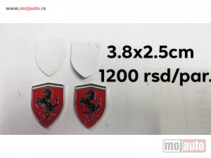 NOVI: delovi  ferrari amblem samolepljivi. dimenzija:3,8x2,5.