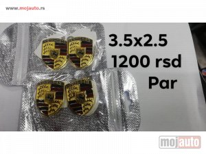 NOVI: delovi  porsche bedž metalni/3m. dimenzija:3,5x2,5cm cena:1200 rsd/par.