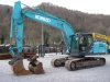 Slika 1 - Kobelco SK210NLC-10 sa 2 kašike - MojAuto