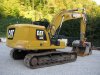 Slika 5 - Caterpillar 320 sa 3 kašike 6.815 - MojAuto